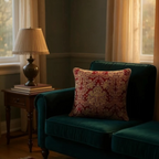 Luxurious jacquard woven cushion cover in red with gold paisley and gold twisted piping, 45x45cm.