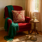 Luxurious jacquard woven cushion cover in red with gold paisley and gold twisted piping, 45x45cm.