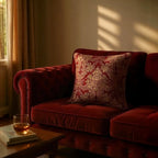Luxurious jacquard woven cushion cover in red with gold paisley and gold twisted piping, 45x45cm.